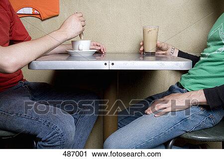 Stock Image - Two people sitting in a cafe. Fotosearch