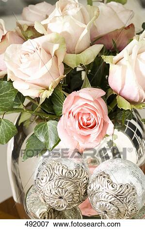 A bouquet of pale pink roses in a silver vase View Large Photo Image Stock Photo - A bouquet of pale pink roses in a silver vase. Fotosearch