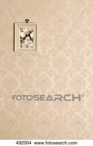 A painting hanging on a wall View Large Photo Image Picture - A painting hanging on a wall. Fotosearch