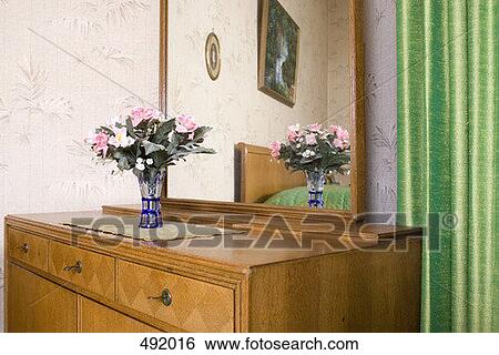 A wooden dresser in a bedroom View Large Photo Image Stock Photograph - A wooden dresser in a bedroom. Fotosearch