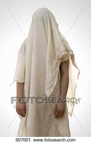 A person standing underneath a white sheet View Large Photo Image Stock Image - A person standing underneath a white sheet. Fotosearch