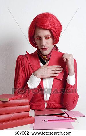 Drag queen sitting at desk View Large Photo Image Stock Image - Drag queen sitting at desk. Fotosearch