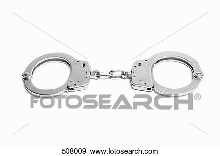 A pair of handcuffs View Large Photo Image Stock Photo - A pair of handcuffs. Fotosearch