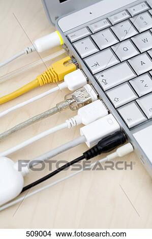 Cables connected to a laptop View Large Photo Image Picture - Cables connected to a laptop. Fotosearch