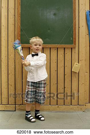A boy on his first day at school View Large Photo Image Stock Photo - A boy on his first day at school. Fotosearch