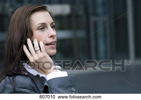 A business woman on her mobile phone View Large Photo Image Stock Image - A business woman on her mobile phone. Fotosearch