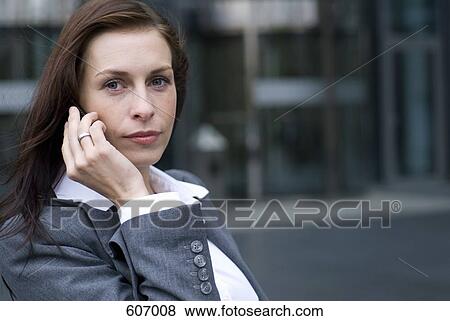 A business woman on her mobile phone View Large Photo Image Stock Photo - A business woman on her mobile phone. Fotosearch