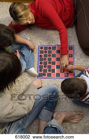 A family playing chess together View Large Photo Image Stock Image - A family playing chess together. Fotosearch