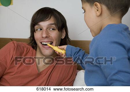 A man and boy playing together View Large Photo Image Picture - A man and boy playing together. Fotosearch