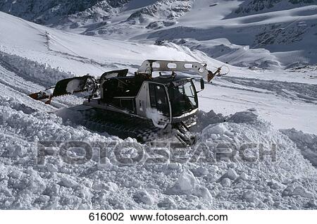 A snow plough on a mountain View Large Photo Image Stock Image - A snow plough on a mountain. Fotosearch