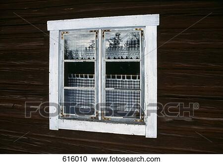 Stock Image - A window in a wooden building. Fotosearch