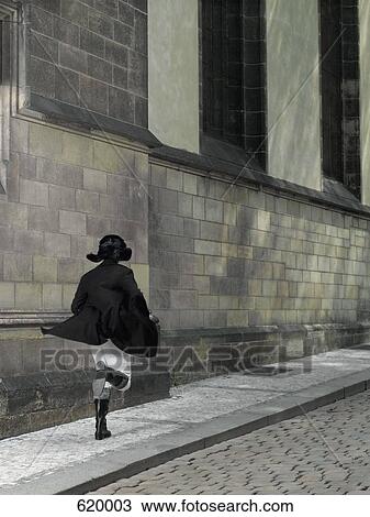 A woman running down a street View Large Photo Image Stock Image - A woman running down a street. Fotosearch