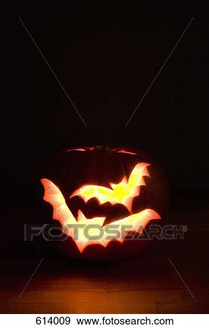 Illuminated Halloween pumpkin View Large Photo Image Stock Photo - Illuminated Halloween pumpkin. Fotosearch