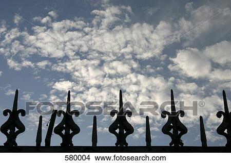 Iron railings and clouds View Large Photo Image Picture - Iron railings and clouds. Fotosearch