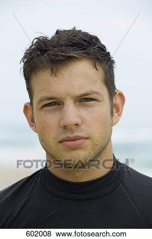 Stock Photo - Portrait of a surfer. Fotosearch