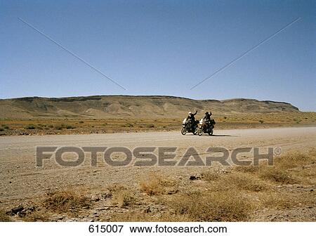 Stock Photo - Two motorcyclists waving. Fotosearch