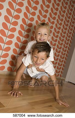 Two Young Boys playing View Large Photo Image Picture - Two Young Boys playing. Fotosearch