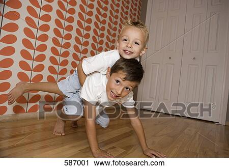 Two Young Boys Rough Housing View Large Photo Image Stock Image - Two Young Boys Rough Housing. Fotosearch