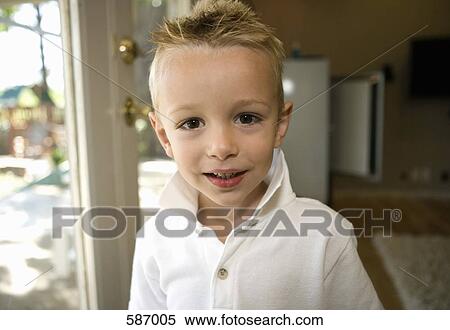 Stock Photography - Young boy Smiling at Camera. Fotosearch