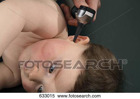 A baby boy’s ear being examined View Large Photo Image Stock Photography - A baby boy’s ear being examined. Fotosearch