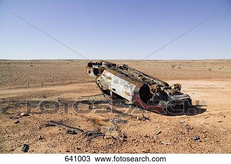 A burnt out car in a desert View Large Photo Image Stock Image - A burnt out car in a desert. Fotosearch