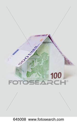 Stock Photo - A Five Hundred Euro Banknote and a Hundred Euro Banknote folded to look like a house. Fotosearch