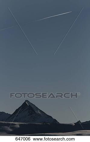 An aeroplane flying above a mountain, Piz Terri, Val Lumnezia, Graubuenden, Switzerland View Large Photo Image Stock Photograph - An aeroplane flying above a mountain, Piz Terri, Val Lumnezia, Graubuenden, Switzerland. Fotosearch
