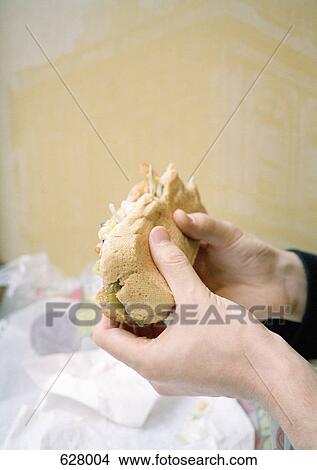 Hands holding a sandwich View Large Photo Image Picture - Hands holding a sandwich. Fotosearch