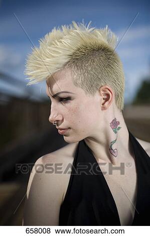 Profile of a young woman with a mohawk View Large Photo Image Stock Photo - Profile of a young woman with a mohawk. Fotosearch