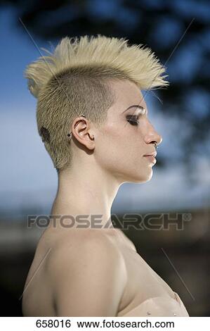 Stock Photograph - Side View portrait of a young punk woman. Fotosearch