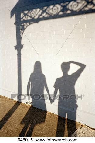 Stock Photography - The shadows of a man and a woman. Fotosearch