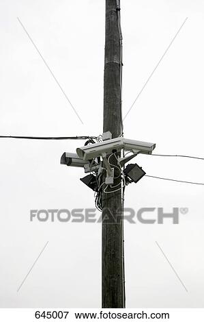 Three Security Cameras posted on a utility pole View Large Photo Image Stock Photo - Three Security Cameras posted on a utility pole. Fotosearch