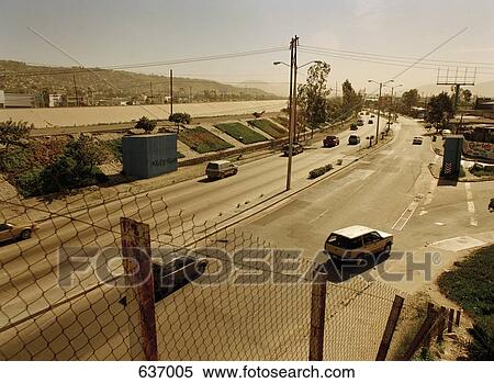 Tijuana, Mexico, Latin America, Cars driving on a road View Large Photo Image Stock Photography - Tijuana, Mexico, Latin America, Cars driving on a road. Fotosearch