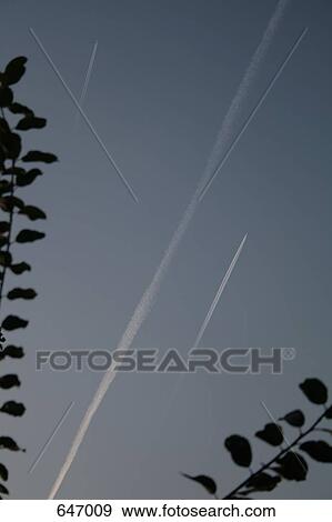 Vapor trails in the sky View Large Photo Image Stock Photo - Vapor trails in the sky. Fotosearch