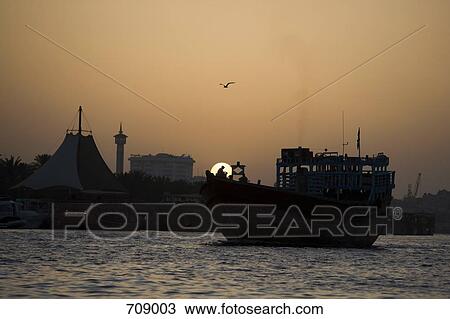 A boat in Dubai Creek at sunset, UAE View Large Photo Image Stock Image - A boat in Dubai Creek at sunset, UAE. Fotosearch