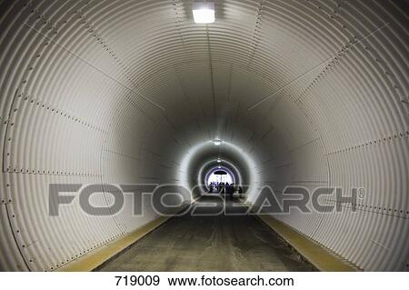 A corrugated iron tunnel View Large Photo Image Stock Photo - A corrugated iron tunnel. Fotosearch