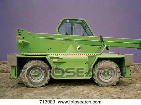 A green vehicle on a construction site View Large Photo Image Stock Photo - A green vehicle on a construction site. Fotosearch