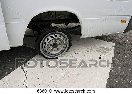 A shredded tire on rim View Large Photo Image Stock Image - A shredded tire on rim. Fotosearch