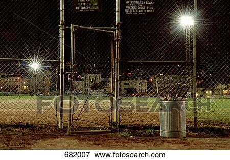 Stock Photo - A sports field illuminated at night. Fotosearch