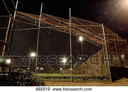 A sports field illuminated at night View Large Photo Image Stock Photo - A sports field illuminated at night. Fotosearch