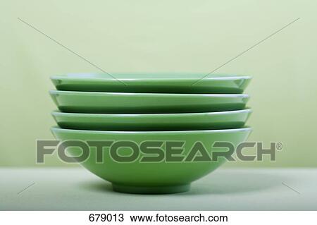 Stock Image - A stack of green bowls, still life. Fotosearch