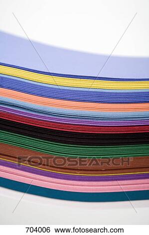 A stack of multi colored paper View Large Photo Image Stock Photograph - A stack of multi colored paper. Fotosearch