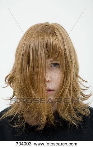 A Woman With Tousled Hair Hanging In Her Face Stock Image 704003