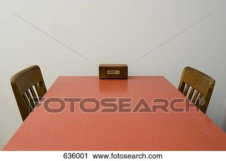 An old fashioned clock on a table View Large Photo Image Stock Image - An old fashioned clock on a table. Fotosearch