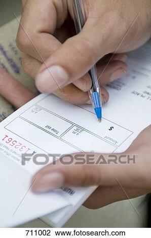 Hands filling out a form View Large Photo Image Stock Image - Hands filling out a form. Fotosearch