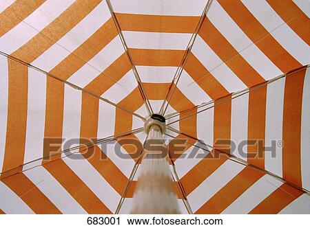 Low angle view of a beach umbrella, close-up View Large Photo Image Stock Image - Low angle view of a beach umbrella, close-up. Fotosearch