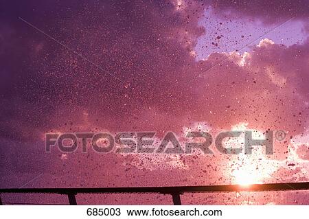 Ocean spray at sunset View Large Photo Image Stock Image - Ocean spray at sunset. Fotosearch