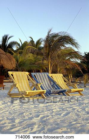 Sun loungers on a beach View Large Photo Image Stock Photograph - Sun loungers on a beach. Fotosearch