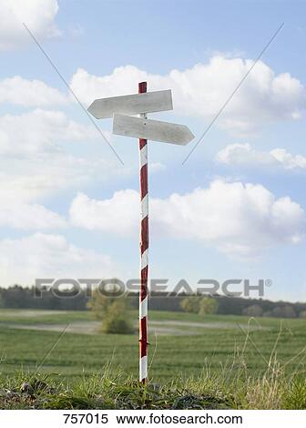 Stock Photography - A blank directional sign post in the country. Fotosearch