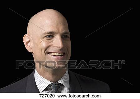 Stock Image - A business man smiling. Fotosearch
